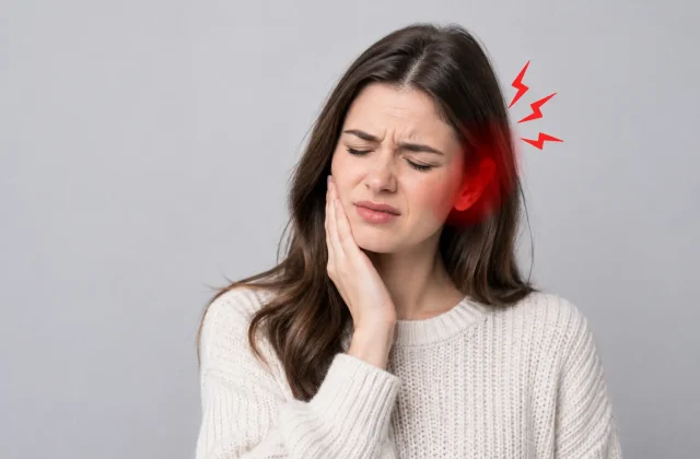 woman experiencing tooth and jaw pain